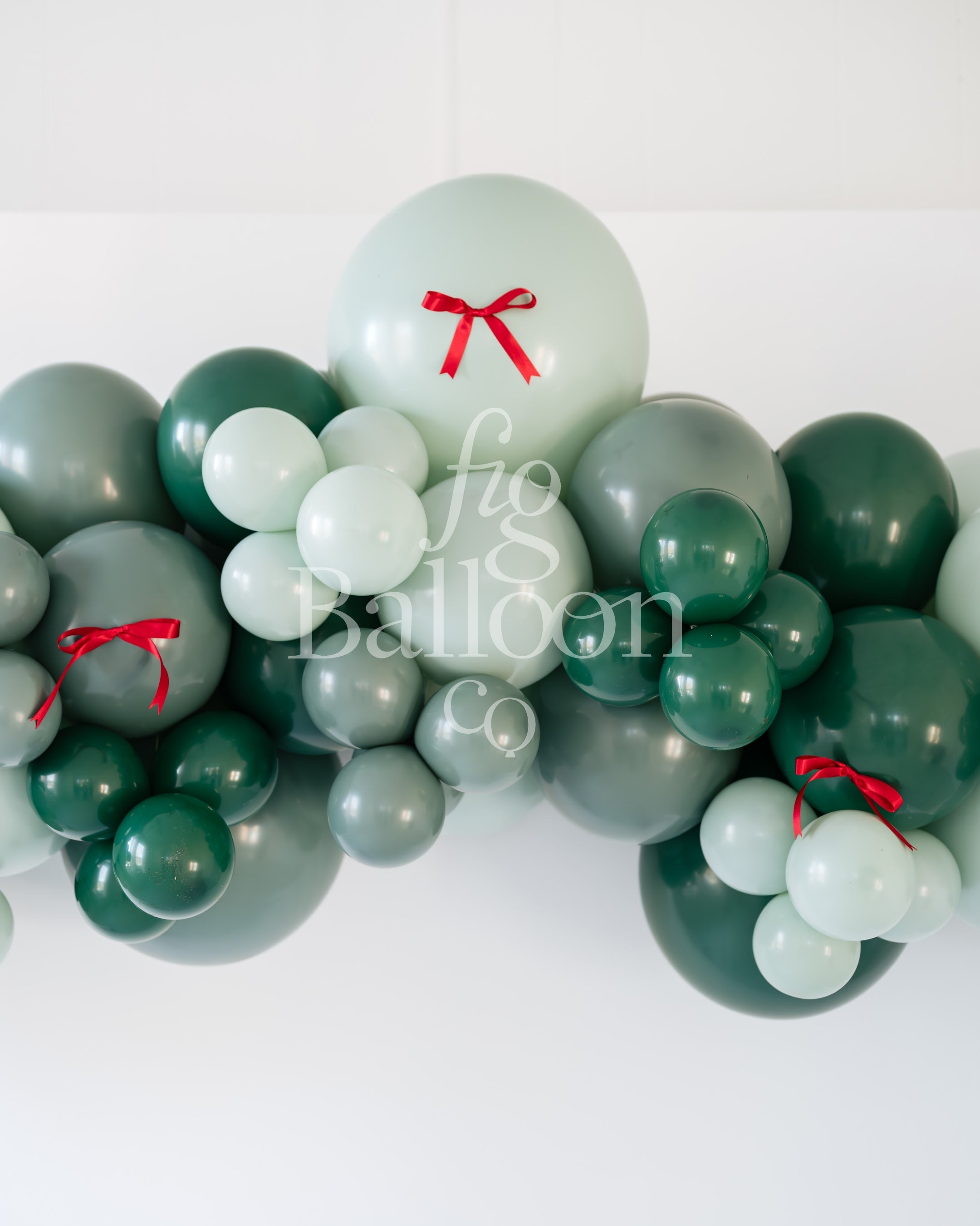 Evergreen with Red Satin Bows Balloon Garland