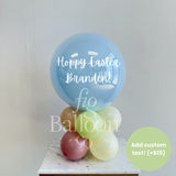 Stack of balloons with 'Happy Easter Branden!' text on a white surface, with a visible brand name.
